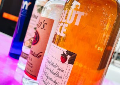 Alcohol bottles at beachside bar